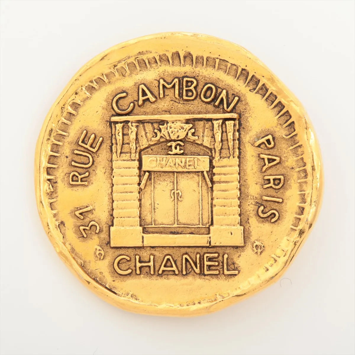 Gold coin with Chanel store design 