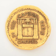 Gold coin with Chanel store design 