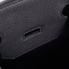 Close-up of a textured black object with a rectangular cutout.