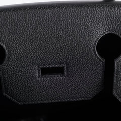 Close-up of a textured black surface with a keyhole