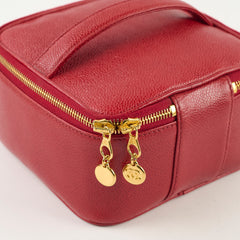 Red leather bag with gold zipper and charms 