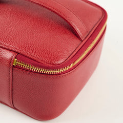 Red leather bag with gold zipper 