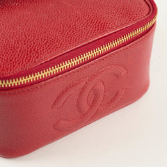 Red leather bag with gold zipper and logo 