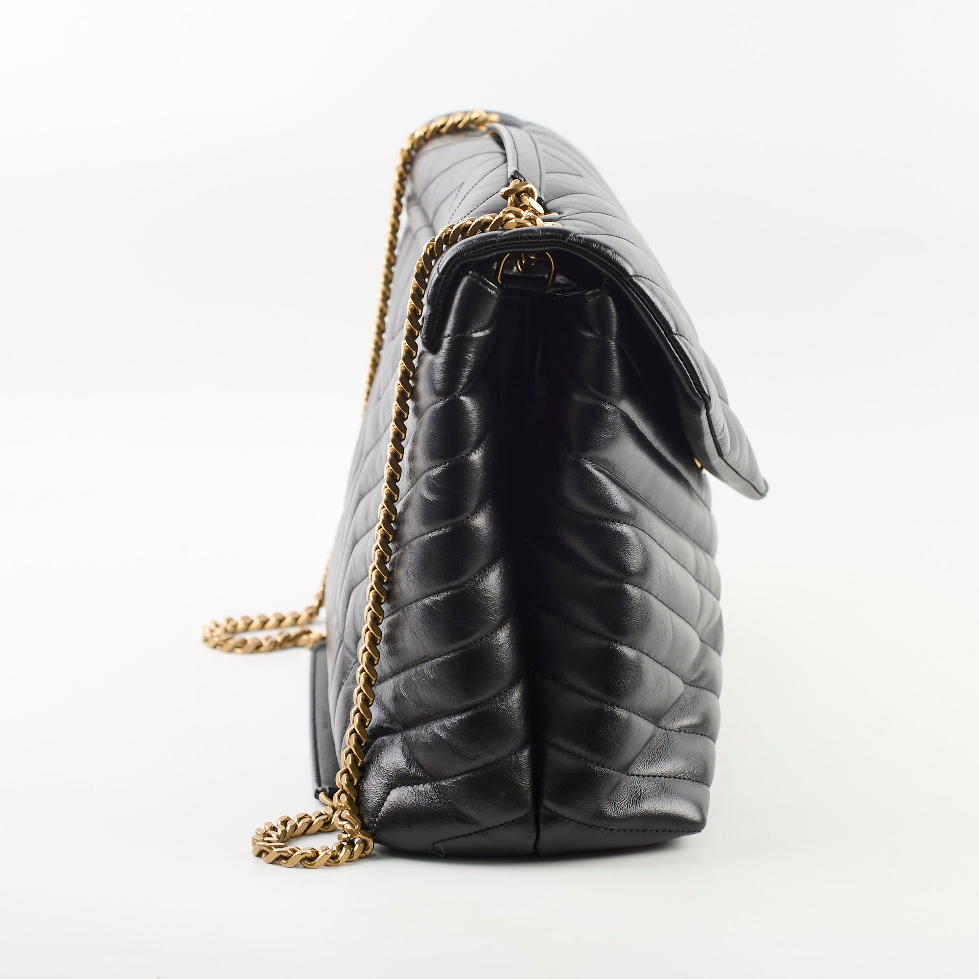 Black quilted handbag with gold chain 