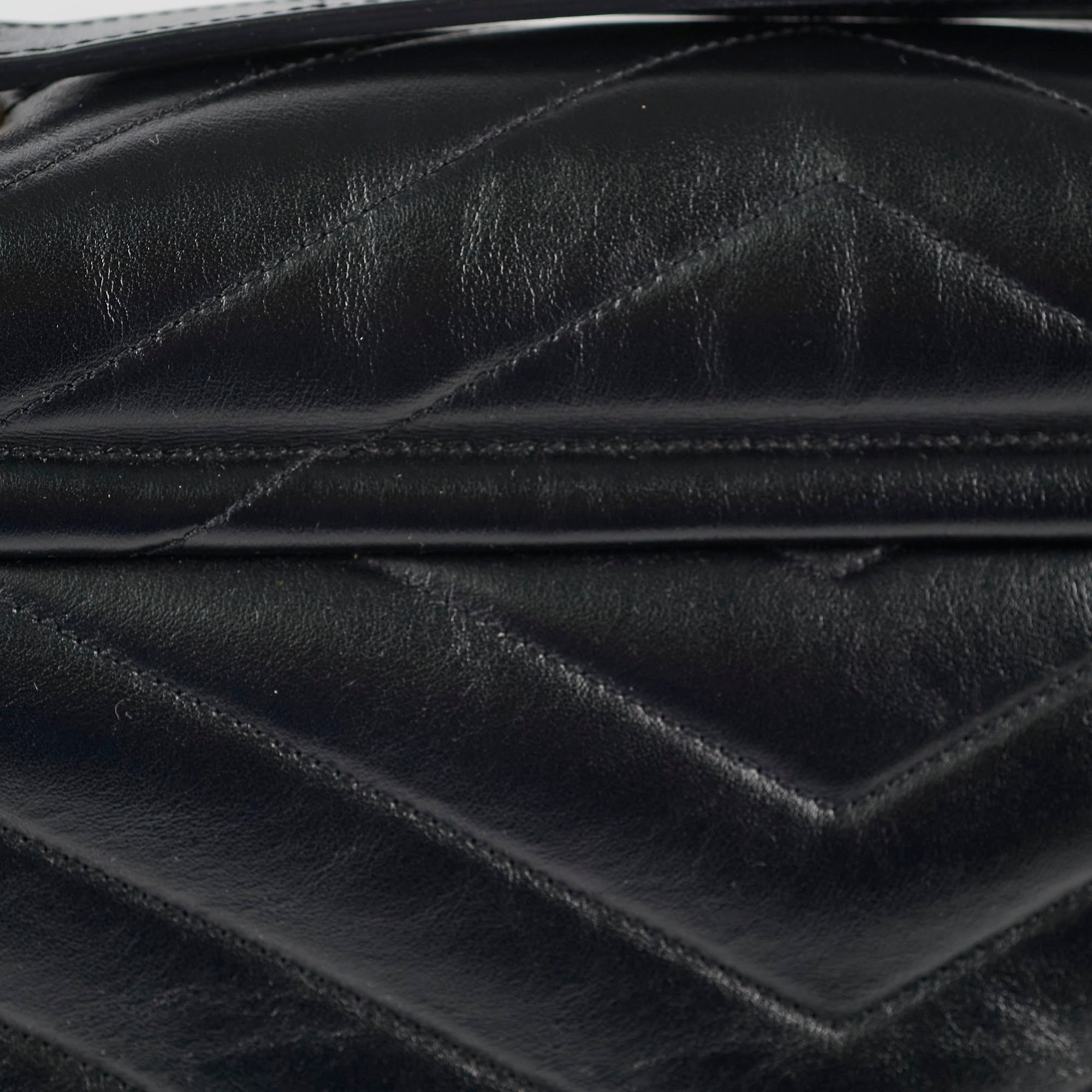 Close-up of a black quilted leather handbag
