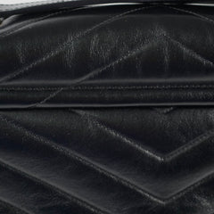 Close-up of a black quilted leather handbag