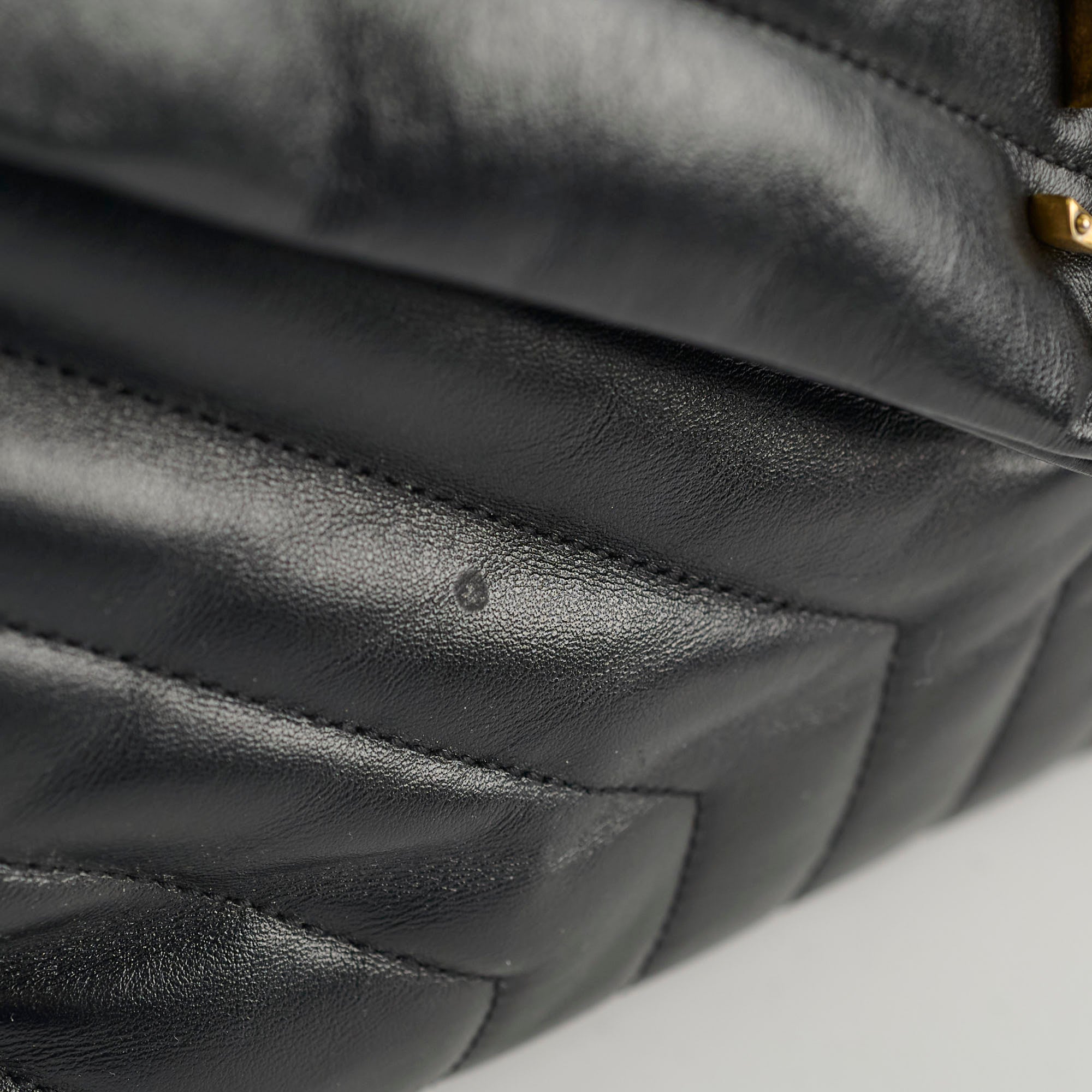 Close-up of a black quilted leather handbag