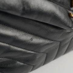 Close-up of a black quilted leather handbag