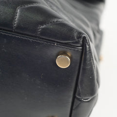 Close-up of a black leather bag with