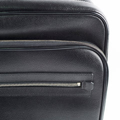 Close-up of a black textured suitcase with a zipper 