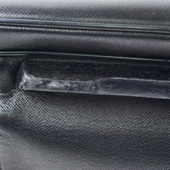 Close-up of a black textured surface with a clear plastic strip.