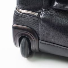 Close-up of a black suitcase wheel 