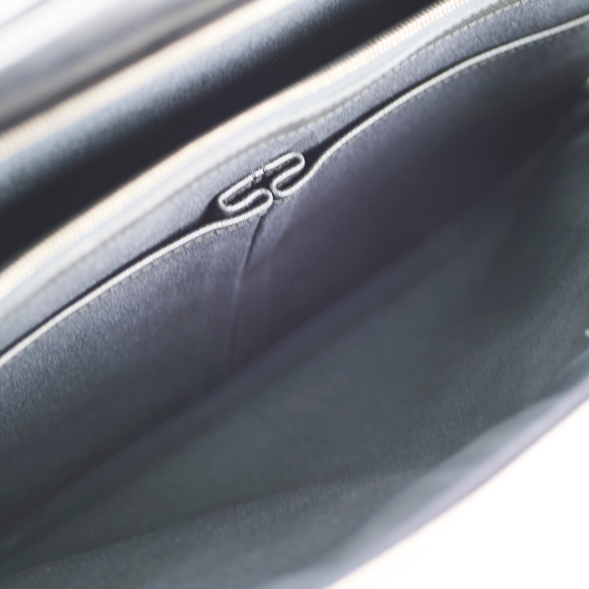 Close-up of a car door panel with a logo 