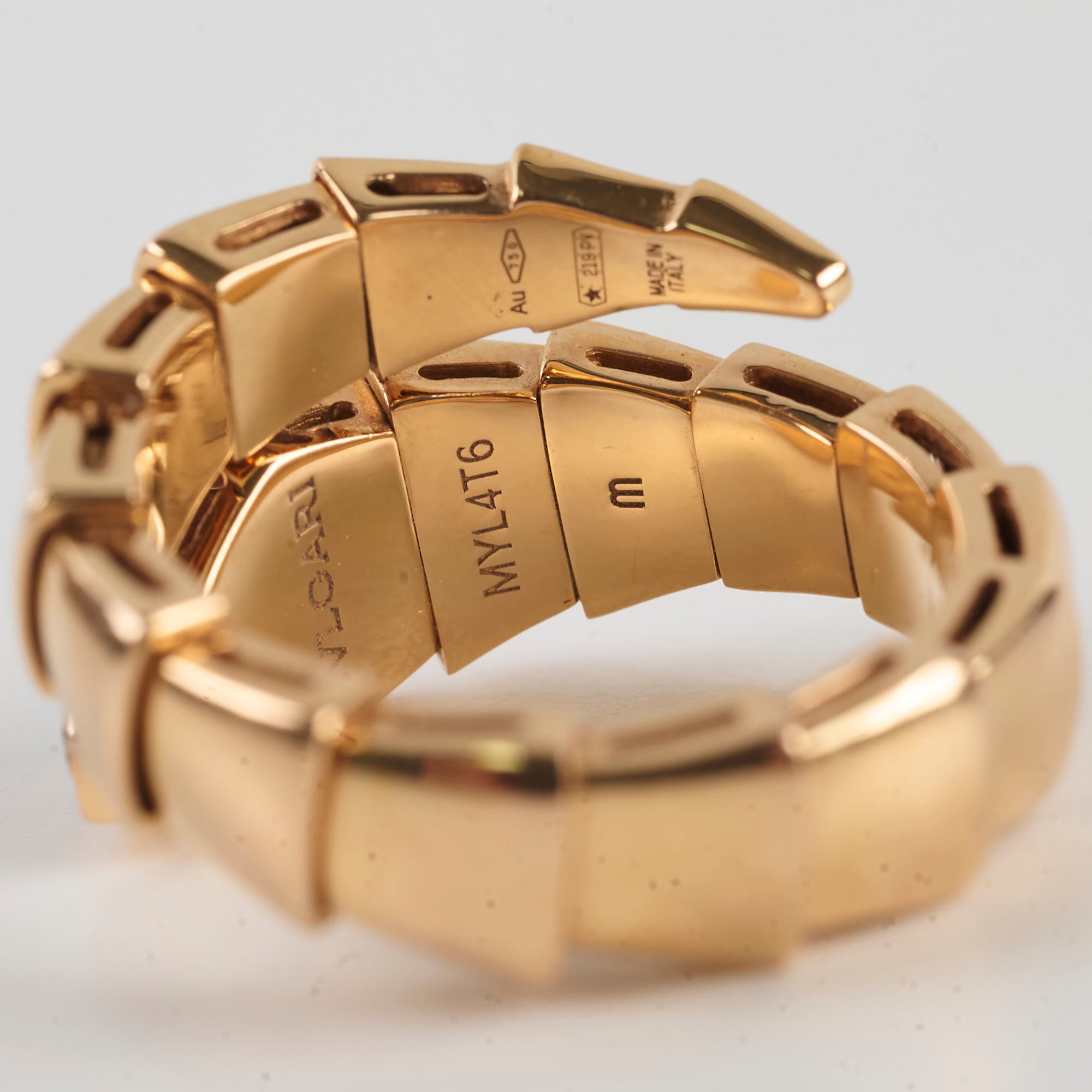 Gold bracelet with a close-up of the clasp 