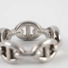 Silver Hermes ring on a white background