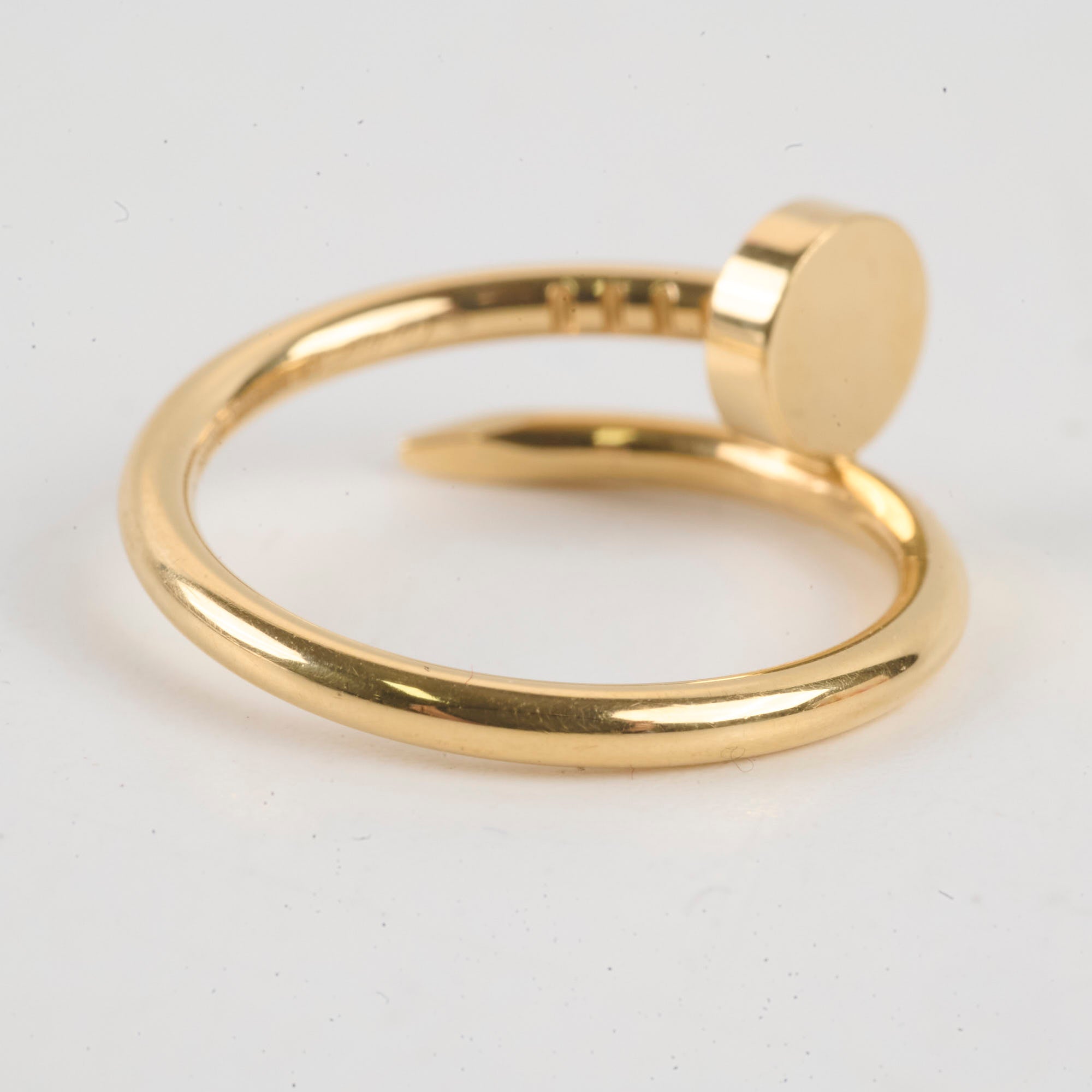 Gold ring with a round cap