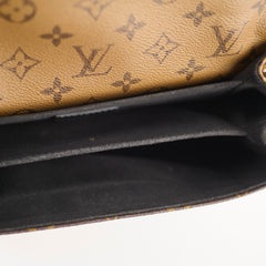 Close-up of a Louis Vuitton wallet with monogram pattern