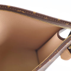 Close-up of a brown leather bag with gold zipper 