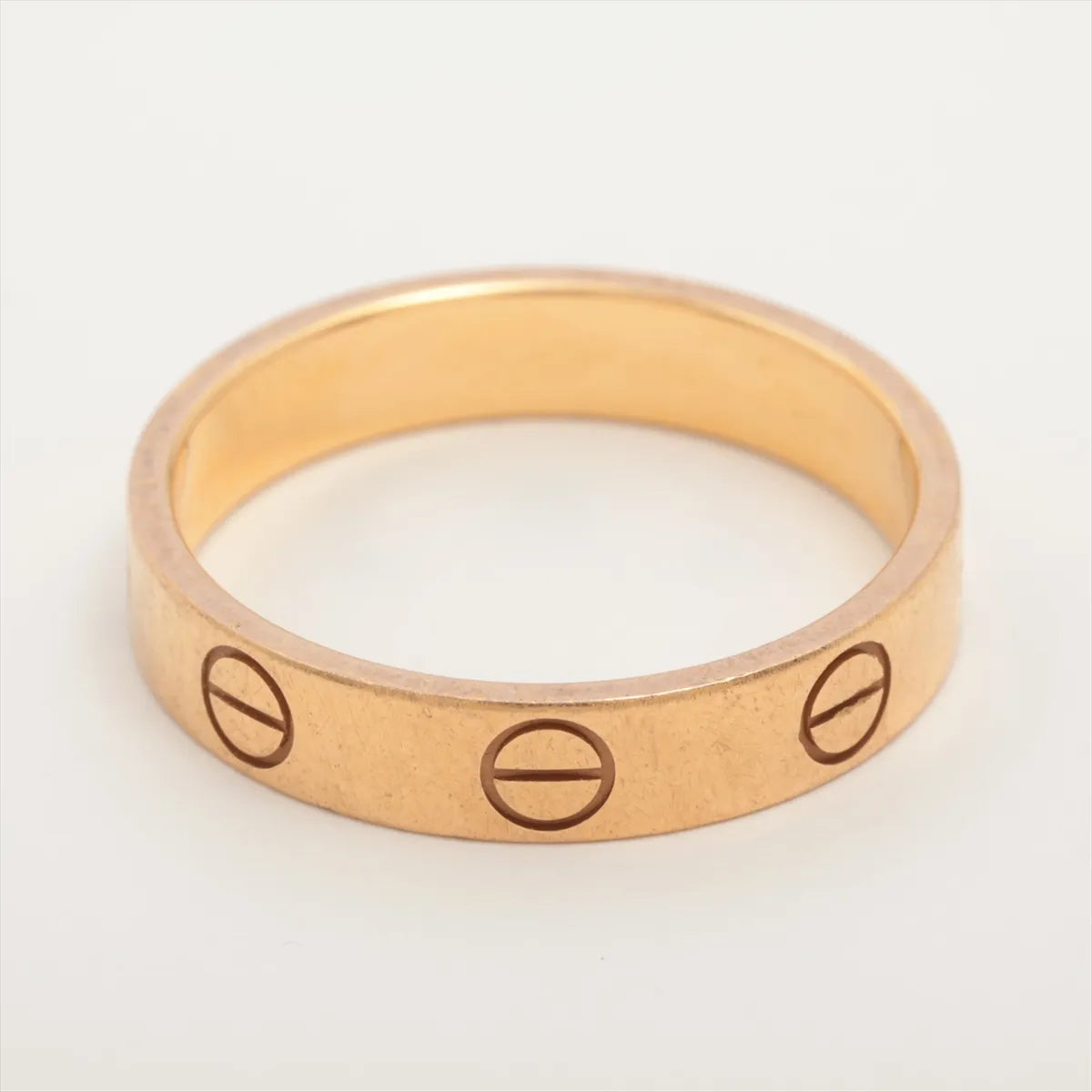 Gold ring with engraved symbols 